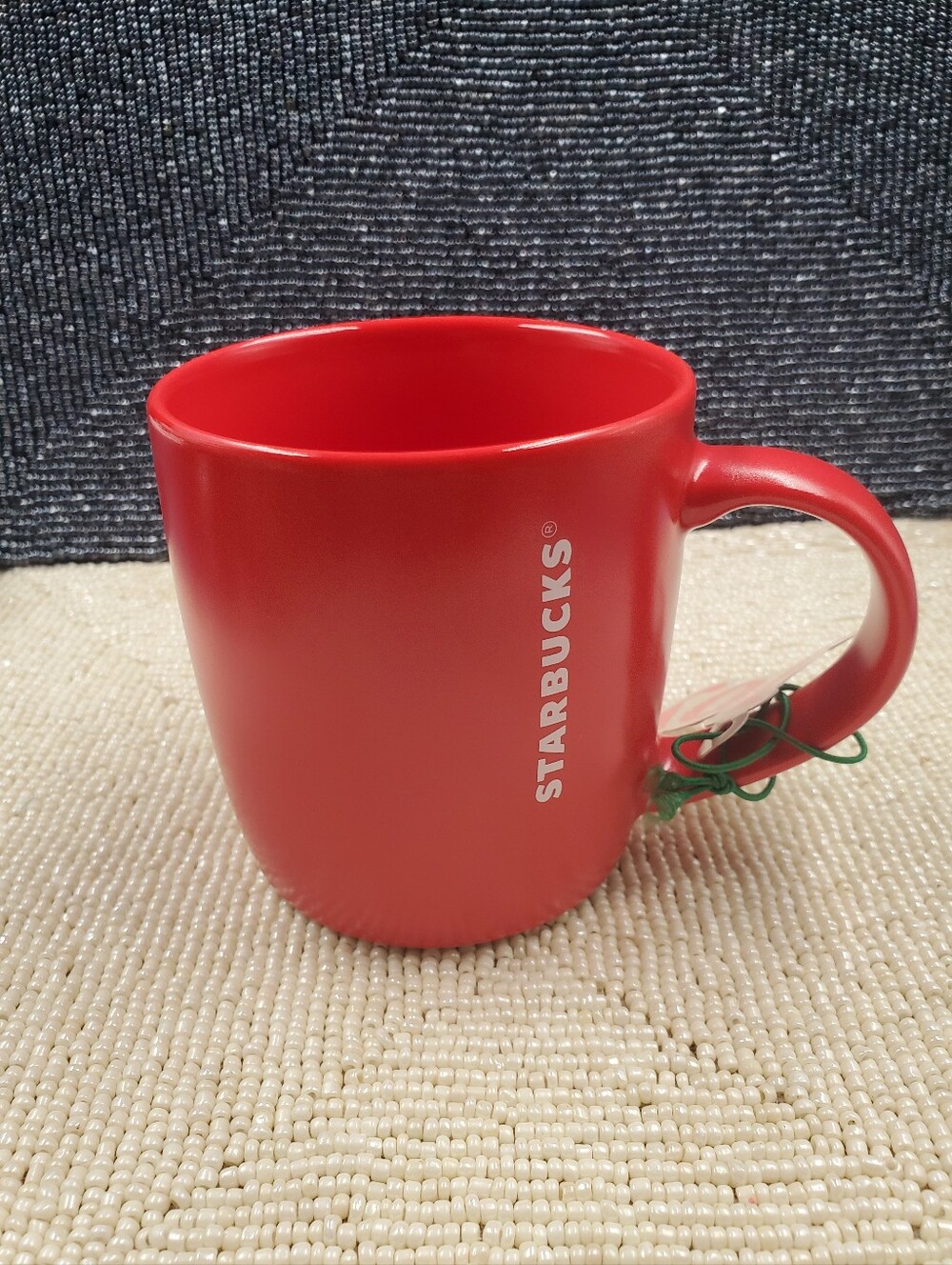 Starbucks mate finished coffee mug featuring a minimalist solid red exterior